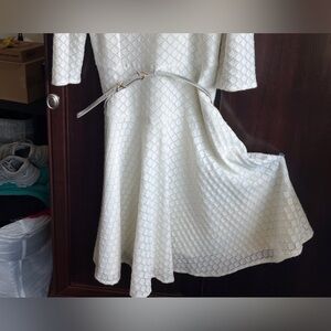 White dress with silver threads imbedded in.  Size 6.